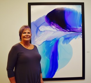 The talented artist in front of her work. I was impressed! It is my dream to have a gallery one day.